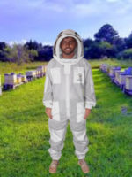 3 Layers Ultra Breeze Ventilated Beekeeping Bee Suit with Fencing Veil worn by a beekeeper during hive inspection. Lightweight triple-layer mesh fabric provides sting-resistant protection, maximum airflow, and all-day comfort. Features a detachable fencing veil, durable zippers, elastic cuffs, and full-body coverage for professional and hobbyist beekeepers.