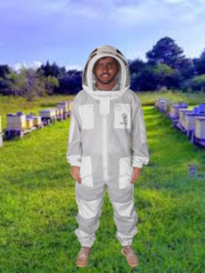 3 Layers Ultra Breeze Ventilated Beekeeping Bee Suit with Fencing Veil worn by a beekeeper during hive inspection. Lightweight triple-layer mesh fabric provides sting-resistant protection, maximum airflow, and all-day comfort. Features a detachable fencing veil, durable zippers, elastic cuffs, and full-body coverage for professional and hobbyist beekeepers.